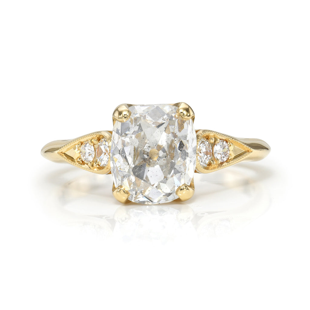 
Single Stone's Amanda ring  featuring 1.99ct F/I2 GIA certified antique cushion cut diamond with 0.14ctw old European cut accent diamonds prong set in a handcrafted 18K yellow gold mounting.
