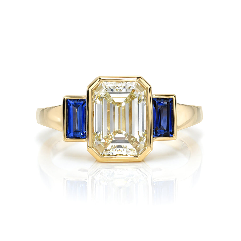 
Single Stone's Amelia ring  featuring 2.01ct M/VS1 GIA certified emerald cut diamond with 0.51ctw baguette cut blue sapphires set in a handcrafted 18K yellow gold mounting.


