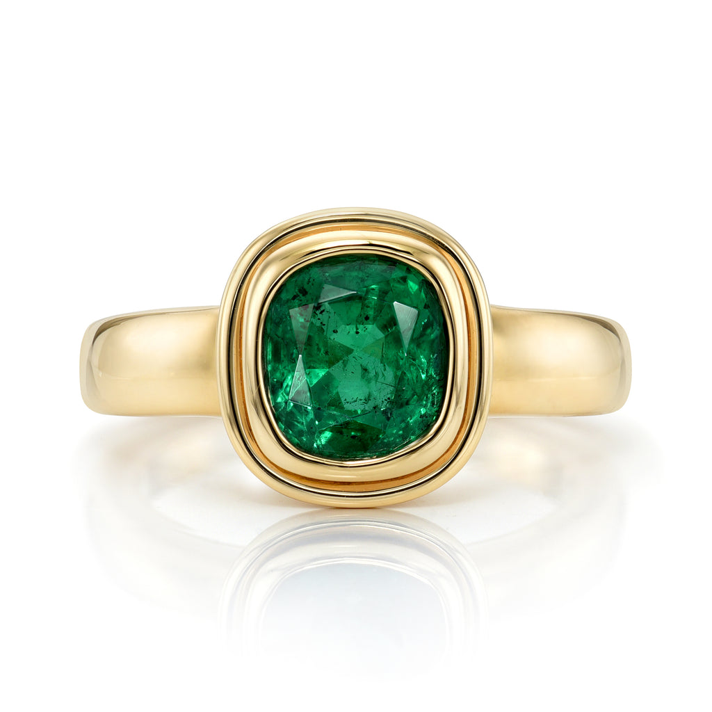 
Single Stone's Aria ring  featuring 1.64ct GIA certified Zambian antique cushion cut green emerald bezel set in a handcrafted 18K yellow gold mounting. 
