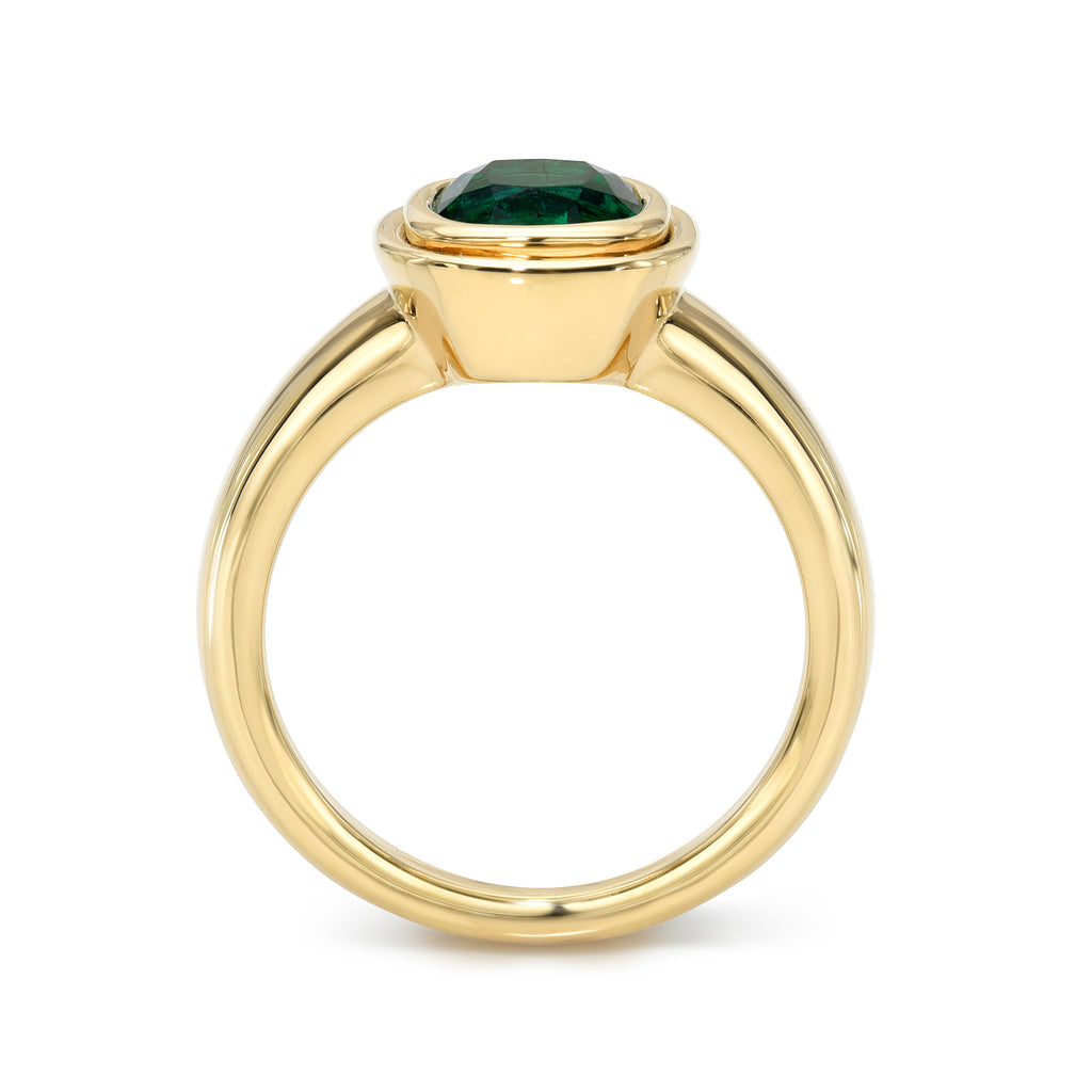 Single Stone's ARIA ring  featuring 1.64ct GIA certified Zambian antique cushion cut green emerald bezel set in a handcrafted 18K yellow gold mounting. 
