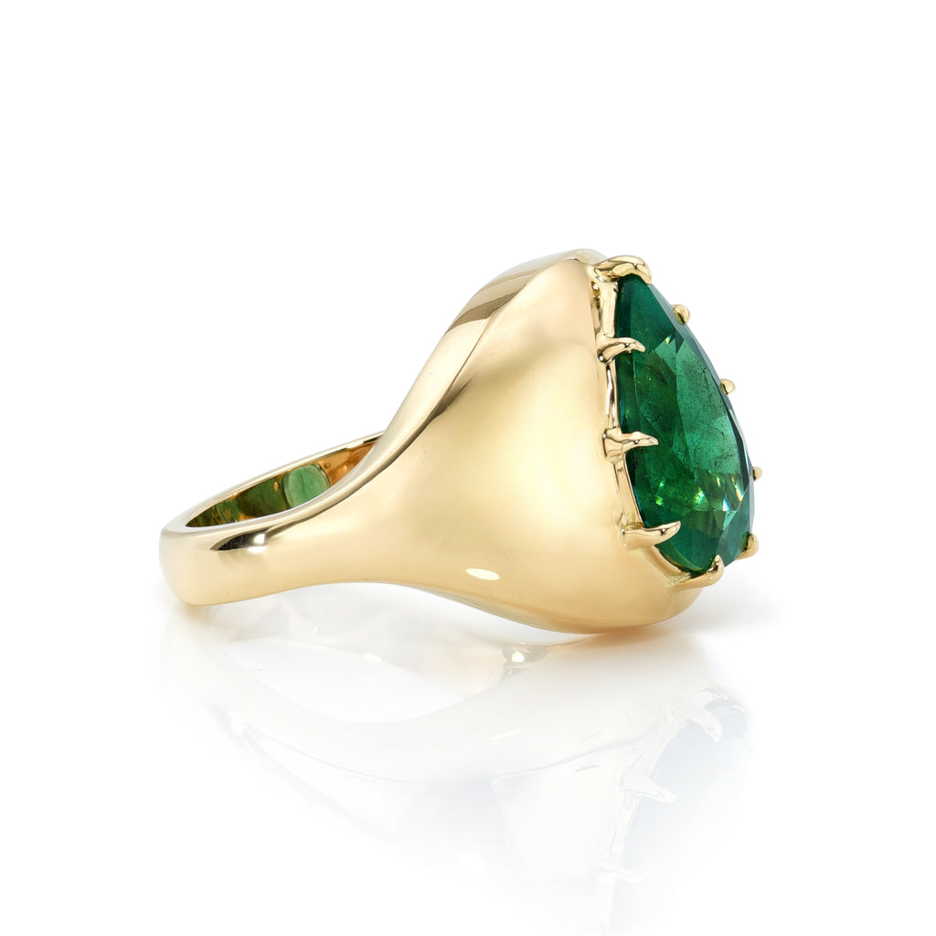 Single Stone's BRYN ring  featuring 4.08ct pear shaped green emerald prong set in a handcrafted 18K yellow gold mounting.

