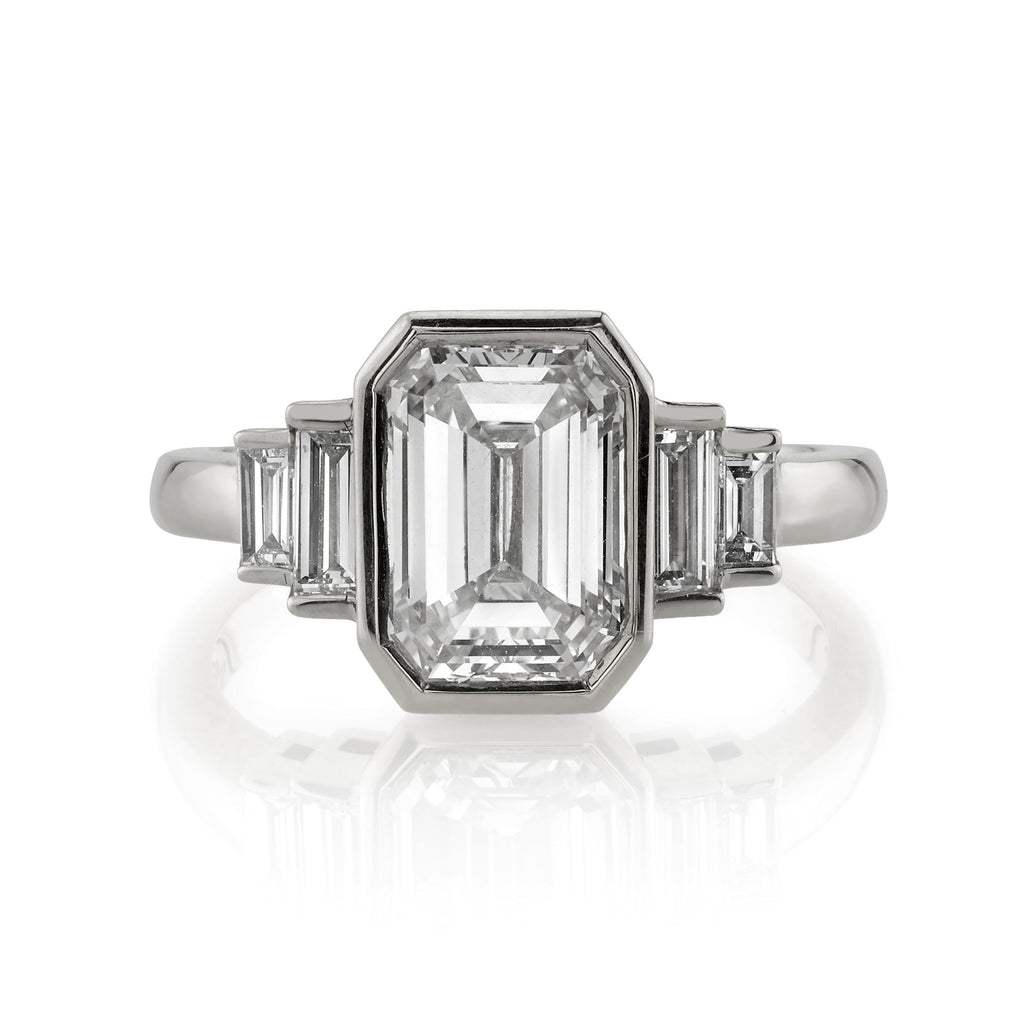 Single Stone's CAROLINE ring  featuring 1.50ct K/VS2 GIA certified emerald cut diamond with 0.52ctw baguette cut accent diamonds bezel set in a handcrafted platinum mounting.
