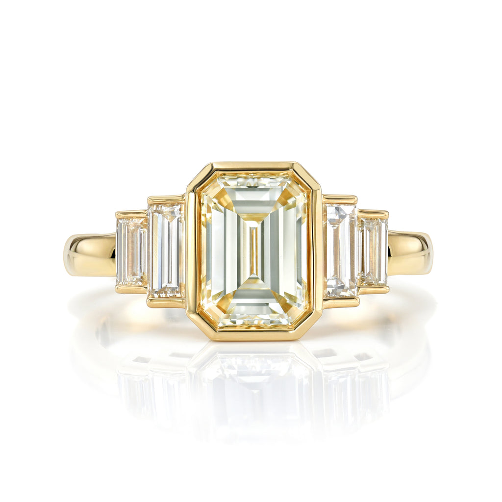 
Single Stone's Caroline ring  featuring 1.51ct M/VS1 GIA certified emerald cut diamond with 0.54ctw baguette cut accent diamonds bezel set in a handcrafted 18K yellow gold mounting.

