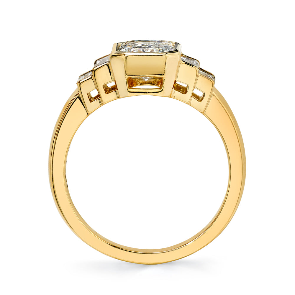 Single Stone's CAROLINE ring  featuring 1.56ct L/VS2 GIA certified emerald cut diamond with 0.48ctw baguette cut accent diamonds bezel set in a handcrafted 18K yellow gold mounting.

