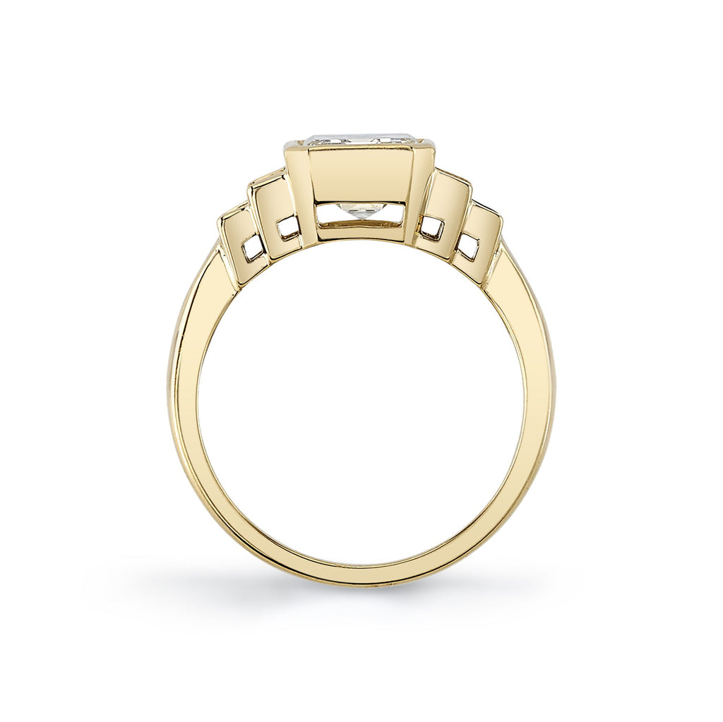 Single Stone's CAROLINE ring  featuring 2.08ct K/VVS1 GIA certified emerald cut diamond with 0.53ctw baguette cut accent diamonds bezel set in a handcrafted 18K yellow gold mounting.  
