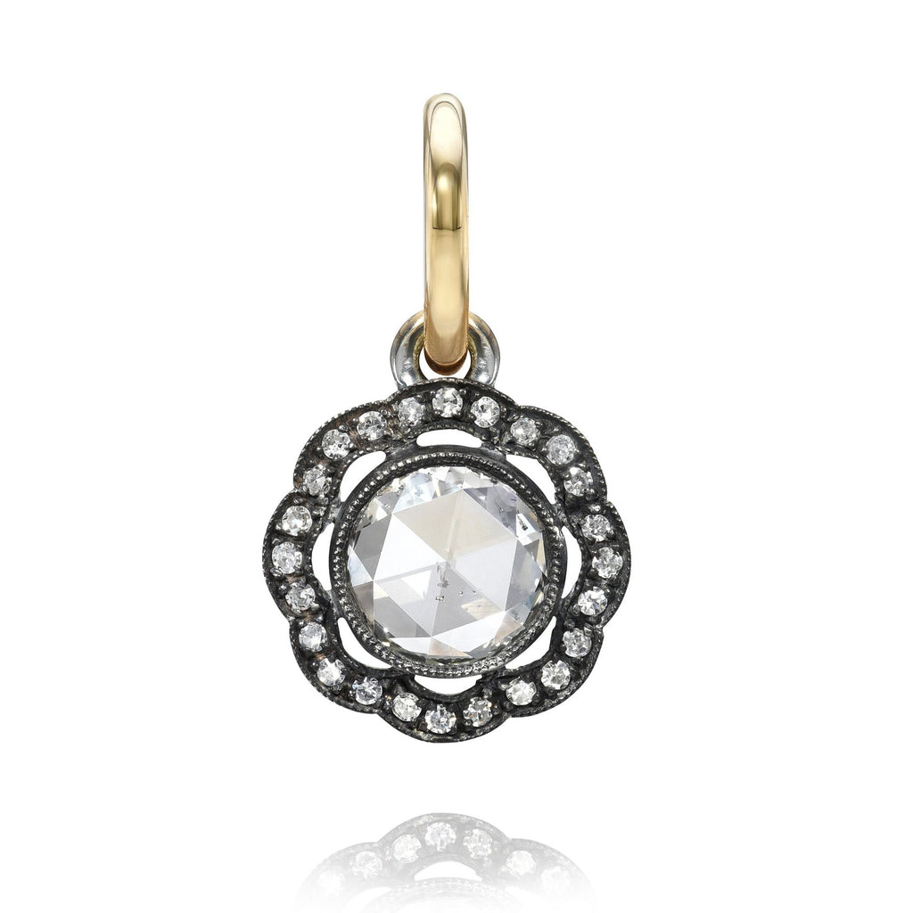 
Single Stone's Charley pendant pendant  featuring 0.96ct K/SI2 round rose cut diamond with 0.10ctw single cut accent diamonds set in a handcrafted 18K yellow gold and oxidized sterling silver pendant.
Price does not include chain.  
