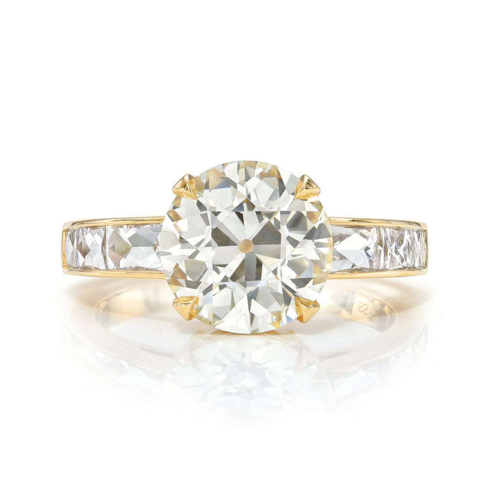 
Single Stone's Christina ring  featuring 3.01ct N/VS2 GIA certified old European cut diamond with 0.84ctw French cut accent diamonds set in a handcrafted 18K yellow gold mounting.

