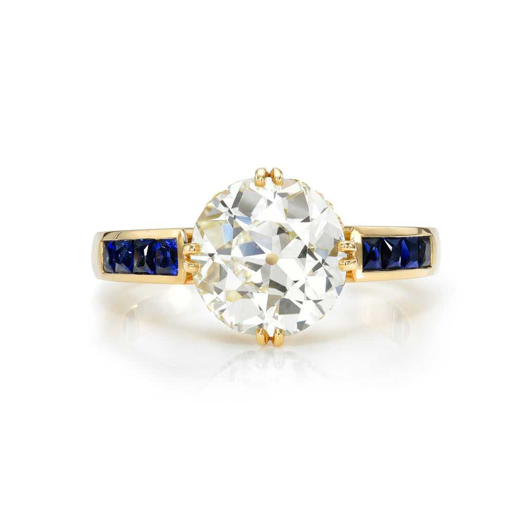 Single Stone's CLARISSA ring  featuring 2.58ct L/VS1 GIA certified old European cut diamond prong set with 0.60ctw French cut blue sapphire accent stones.
