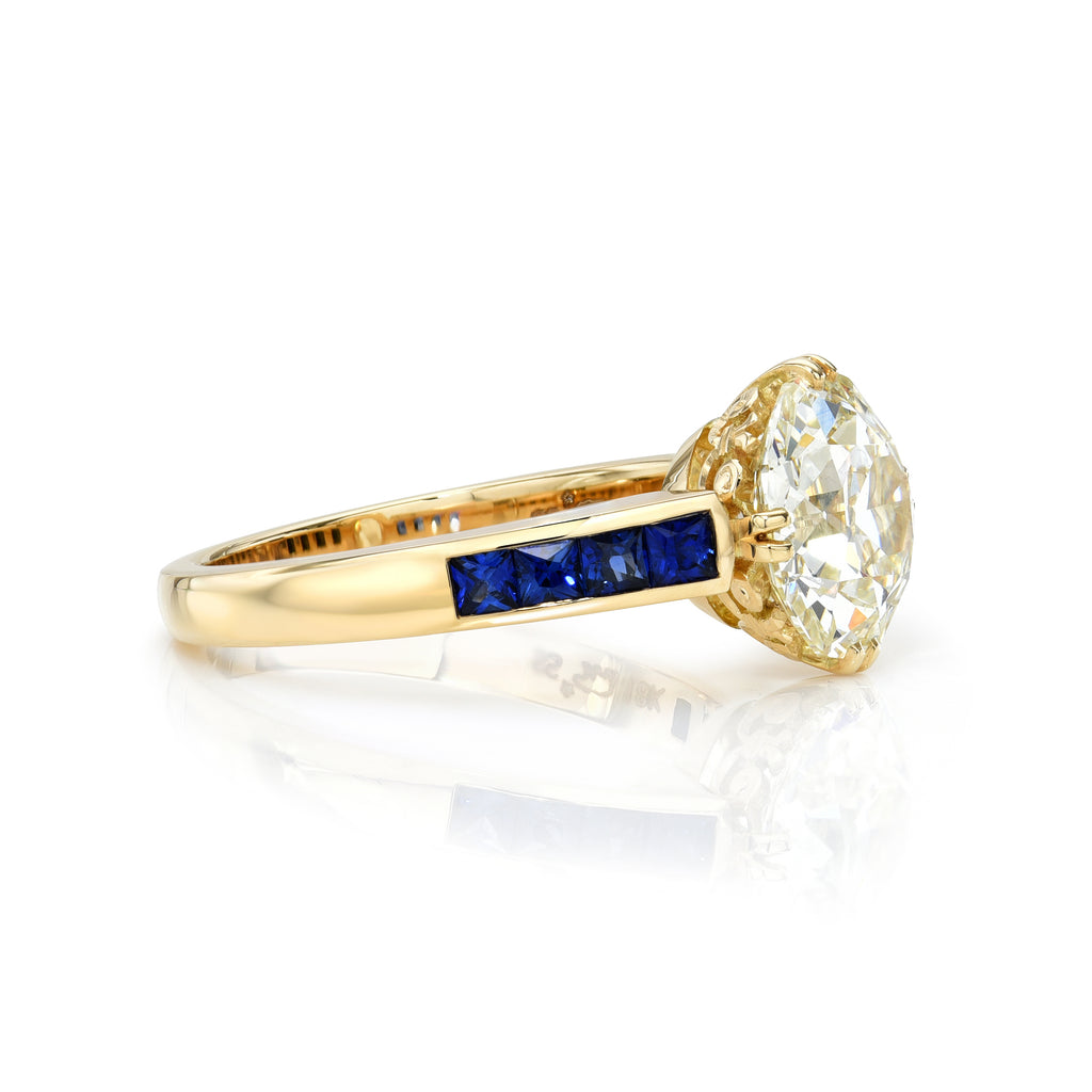 Single Stone's CLARISSA ring  featuring 2.58ct L/VS1 GIA certified old European cut diamond prong set with 0.60ctw French cut blue sapphire accent stones.
