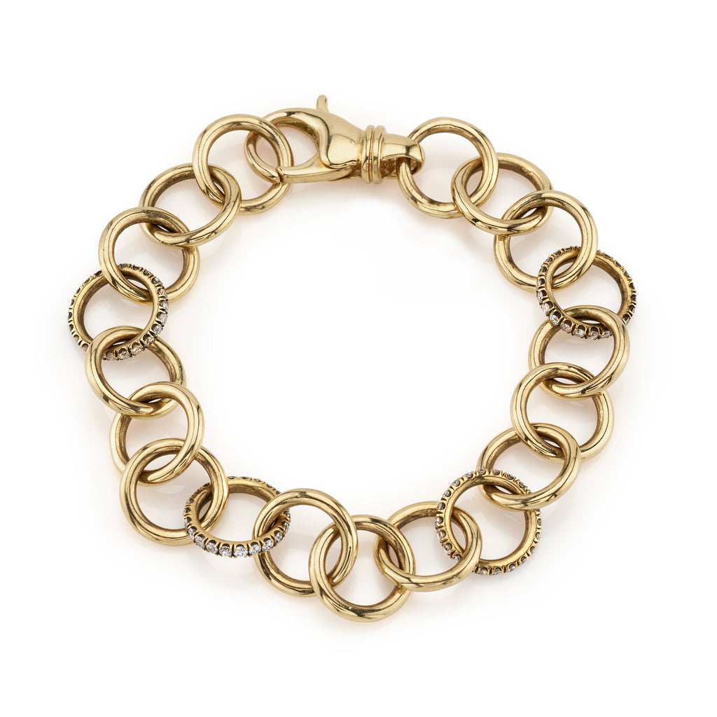 
Single Stone's Club bracelet with diamonds band  featuring Handcrafted 18K yellow gold club bracelet with approximately 1.60ctw G-H/VS old European cut diamonds. Bracelet measures 7.5". 

