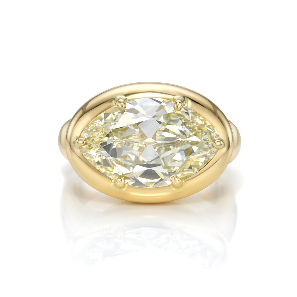 
Single Stone's Cori ring  featuring 5.88ct M/SI1 GIA certified moval cut diamond prong set in a handcrafted 18K yellow gold mounting.
