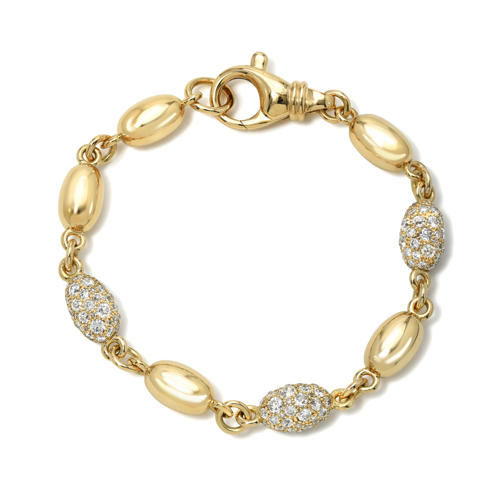 Single Stone's DOROTHY LUXE BRACELET, COBBLESTONE  featuring Approximately 6.20-6.30ctw varying old and round brilliant cut diamonds set on a handcrafted 18K yellow gold satin finish large oval bead bracelet.

