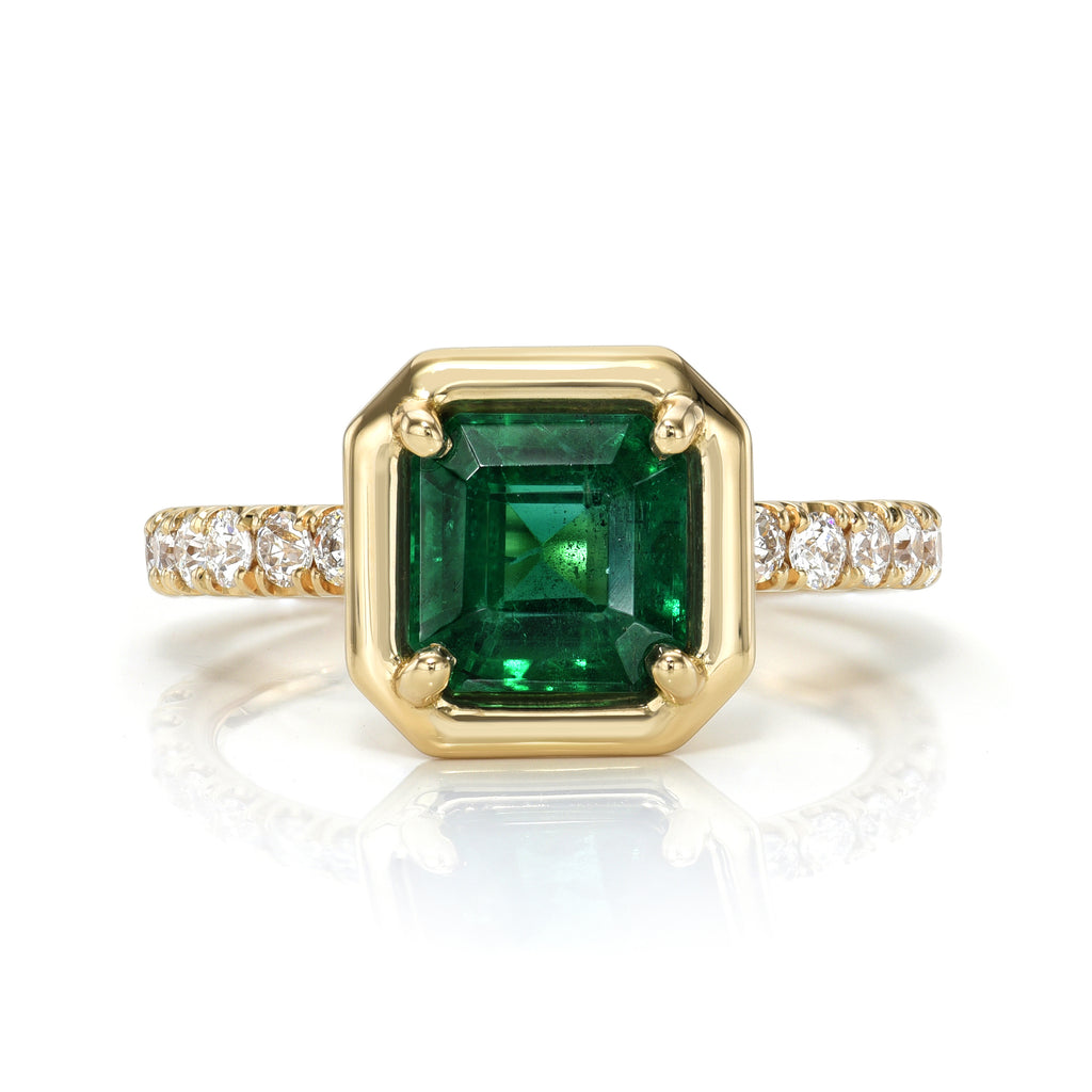 
Single Stone's Ella ring  featuring 1.69ct GIA certified Zambian Asscher cut green emerald with 0.40ctw old European cut accent diamonds prong set in a handcrafted 18K yellow gold mounting.
