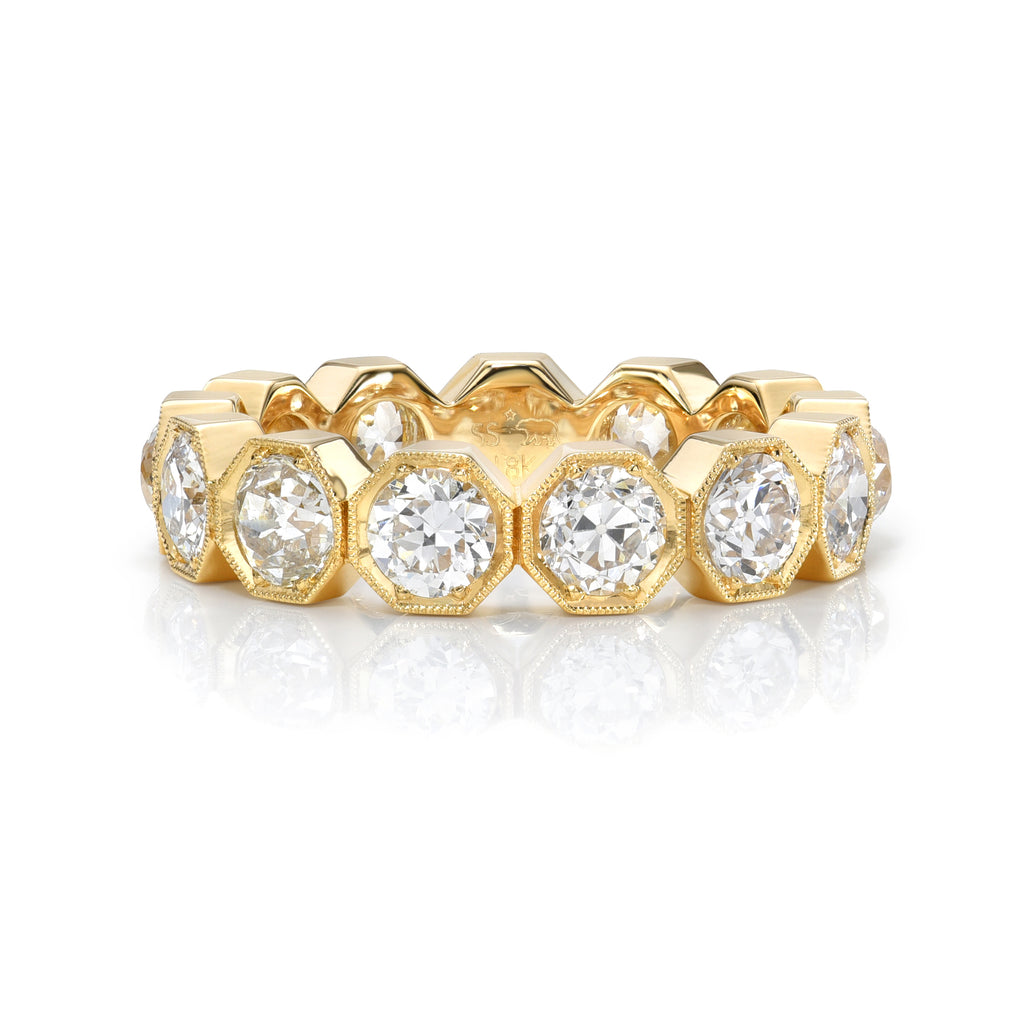
Single Stone's Gemma large band  featuring Approximately 2.90-3.10ctw G-H/VS-SI old European cut diamonds prong set in a handcrafted octagonal framed eternity band. 
 
