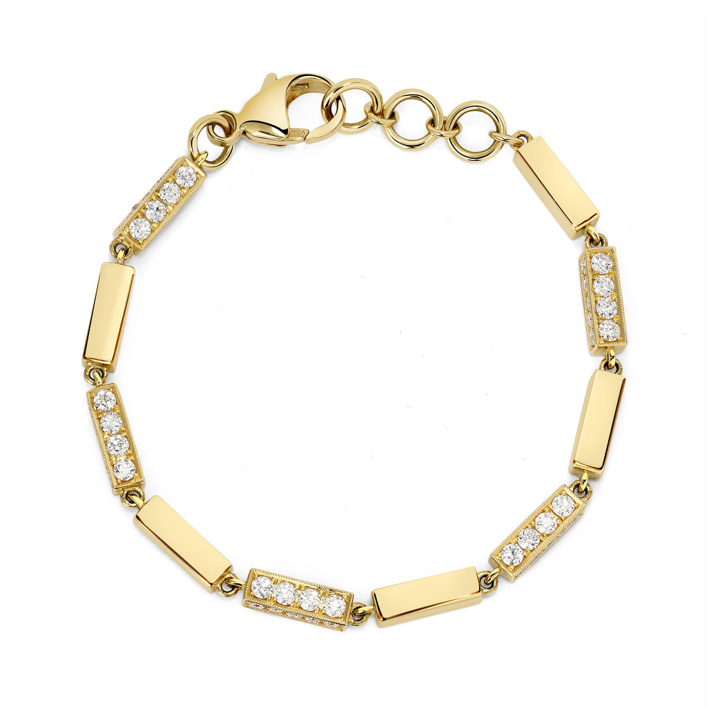
Single Stone's Giana bracelet with diamonds  featuring Approximately 3.45ctw G-H/VS old European cut diamonds prong set on a handcrafted 18K yellow gold full bar bracelet. 
Bracelet measures 7.5"

