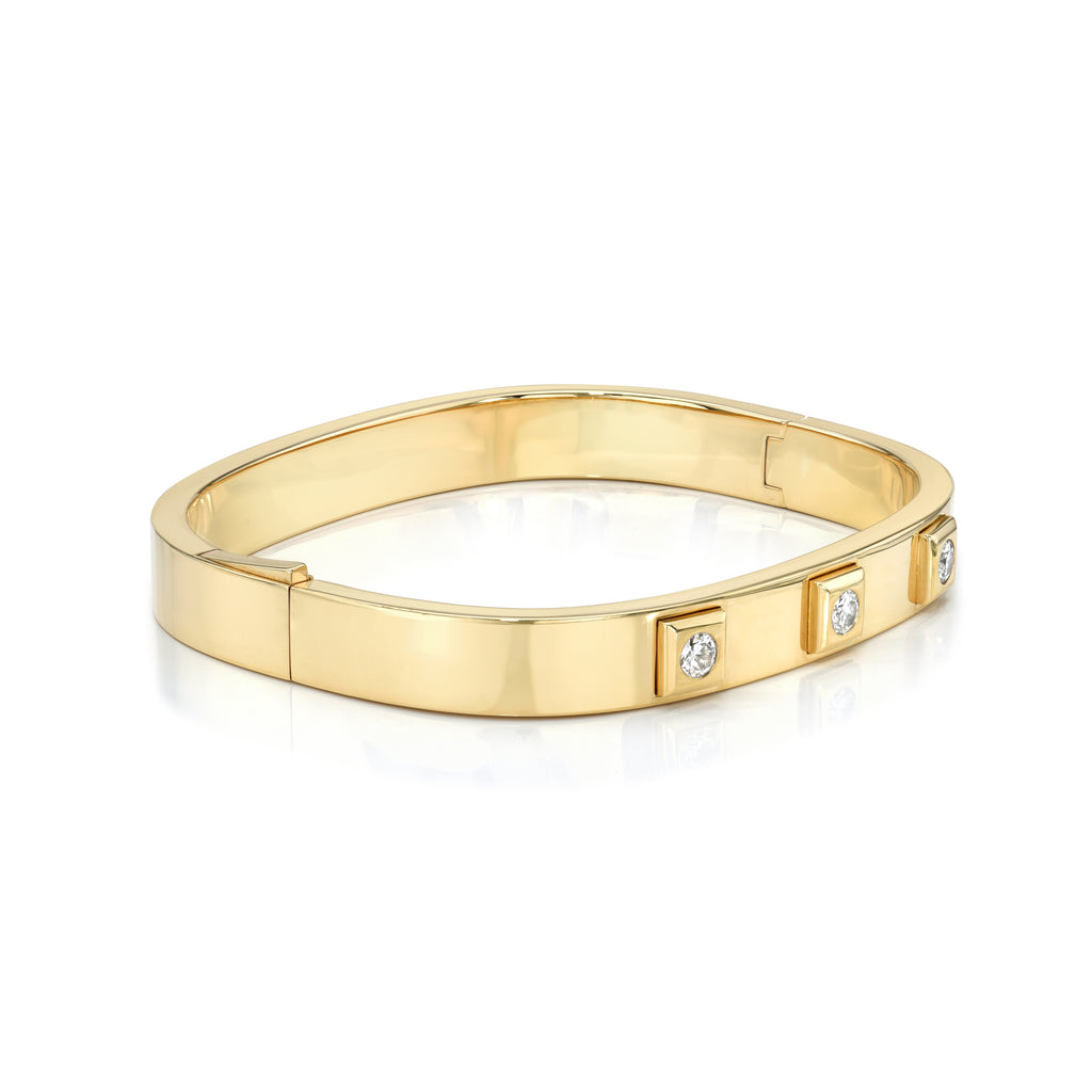 Single Stone's HUDSON BANGLE  featuring Approximately 0.45-0.50ctw old European cut diamonds bezel set in a handcrafted 18K yellow gold bangle bracelet.
