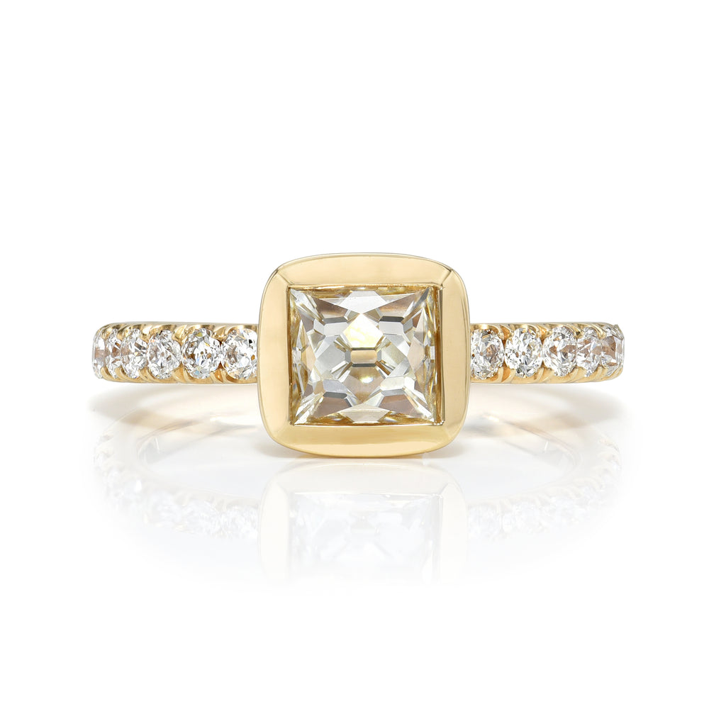 
Single Stone's Karina ring  featuring 1.09ct J/VS1 GIA certified French cut diamond with 0.42ctw old European cut accent diamonds set in a handcrafted 18K yellow gold mounting.
 

