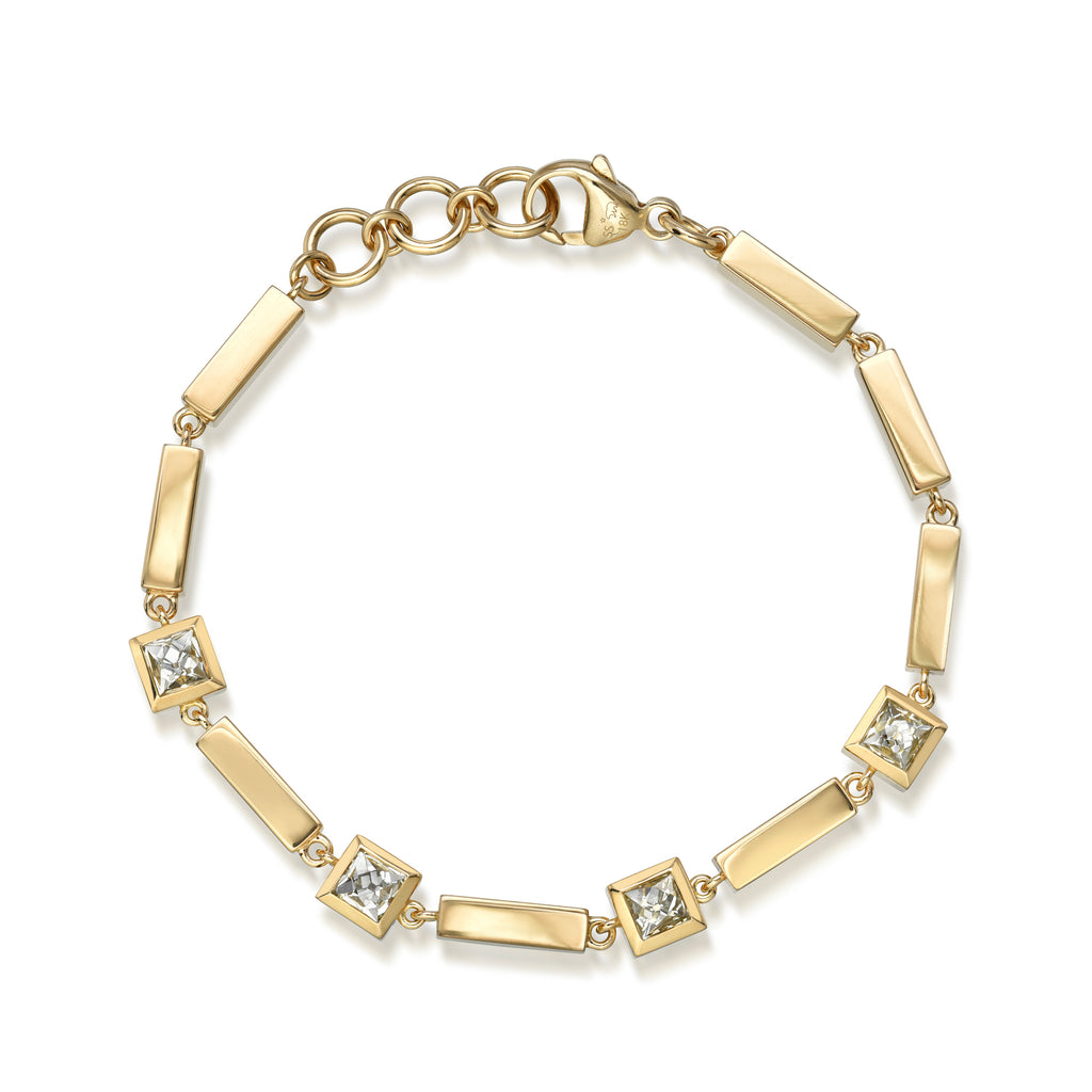 
Single Stone's Kiara bracelet  featuring 2.00ctw H-J/VS-SI French cut diamonds bezel set on a handcrafted 18K yellow gold bracelet.
Bracelet measures 7.5" 
