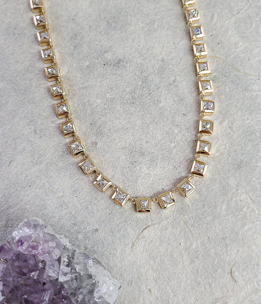 French cut diamonds bezel set in Single Stone's 'Karina' setting, linked together in a riviera necklace