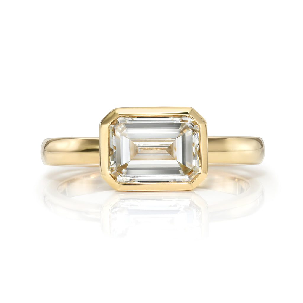 Single Stone's LEAH ring  featuring 1.58ct J/VVS2 GIA certified emerald cut diamond bezel set in a handcrafted 18K yellow gold mounting.
