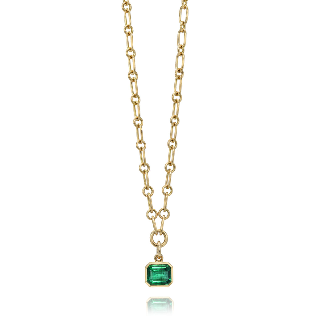 Single Stone's LEAH DROP NECKLACE  featuring 1.77ct GIA certified Zambian Asscher cut green emerald bezel set in a handcrafted 18K yellow gold drop pendant necklace. Necklace measures 17&quot;.
