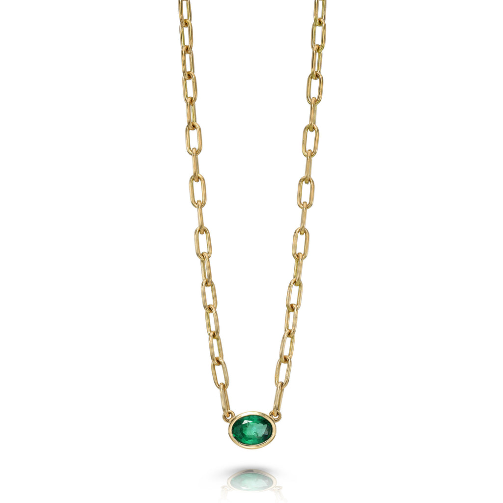 
Single Stone's Leah necklace pendant  featuring 0.65ct oval cut green emerald bezel set on our handcrafted 18K yellow gold Bond chain.
Necklace measures 17"
