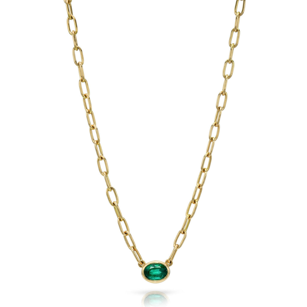 Single Stone's LEAH NECKLACE  featuring 0.89ct oval cut green emerald bezel set on a handcrafted 18K yellow gold pendant necklace. Necklace measures 17&quot;
