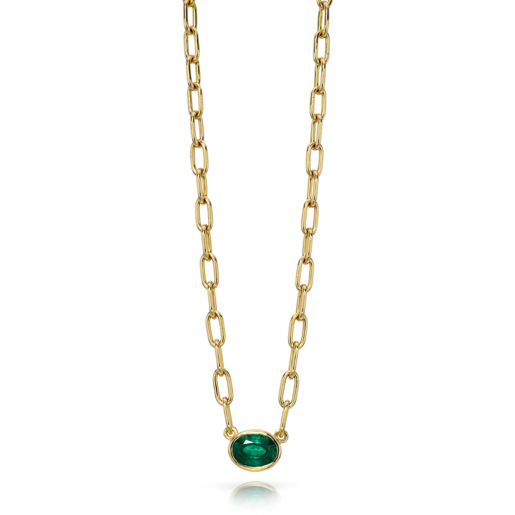 
Single Stone's Leah necklace pendant  featuring 1.01ct oval cut green emerald bezel set on a handcrafted 18K yellow gold pendant necklace.
Necklace measures 17".
