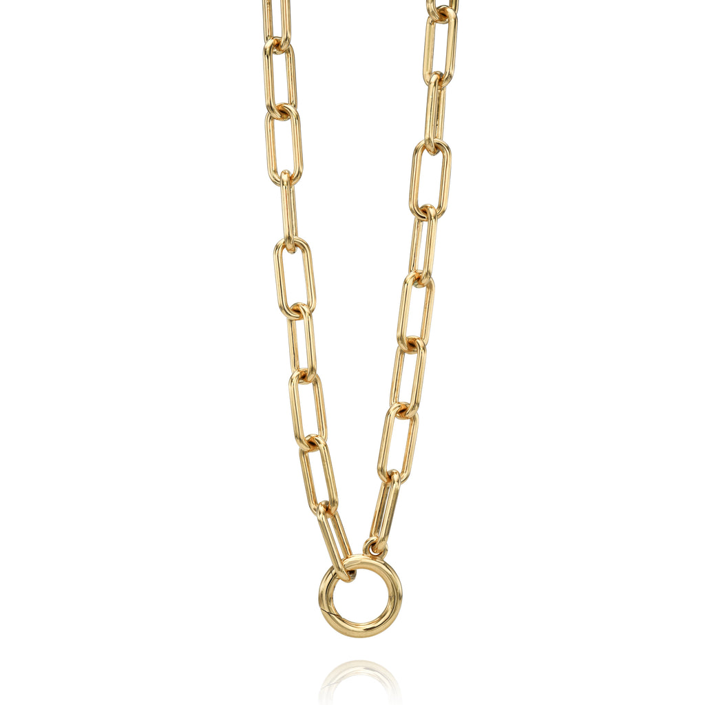 
Single Stone's Libby annex  featuring Handcrafted 18K yellow gold paperclip link necklace with round charm enhancer.
Necklace measures 18".
