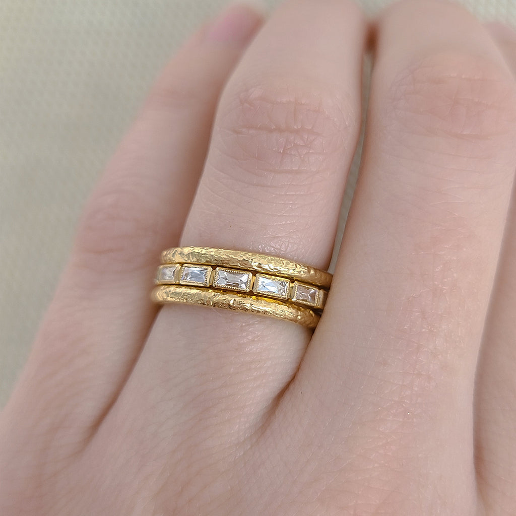 Single Stone's SMALL JULIA band  featuring Approximately 0.75ctw G-H/VS French cut diamonds bezel set in a handcrafted eternity band.  Approximate band with 2.1mm. Please inquire for additional customization. 
