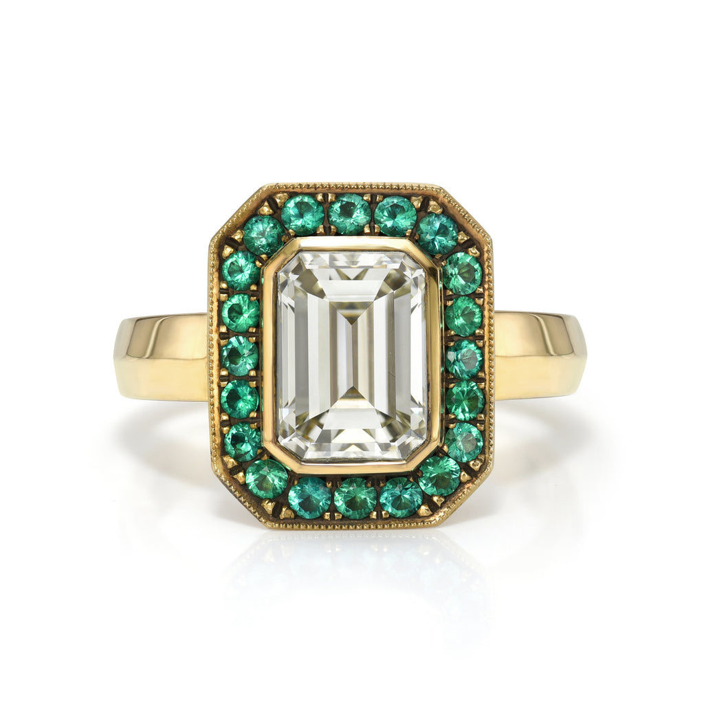 
Single Stone's Maria pavé ring  featuring 2.02ct M/VVS1 GIA certified bezel set emerald cut diamond with 0.30ctw round cut green emerald accent gemstones pavé set in a handcrafted, lightly oxidized 18K yellow gold mounting.
