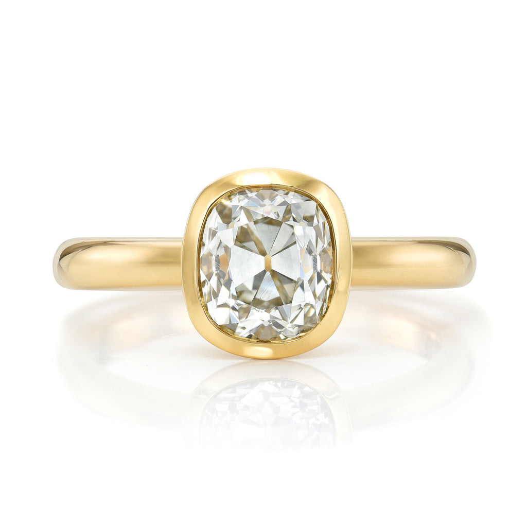 Single Stone's MARNI ring  featuring 1.68ct L/SI1 GIA certified antique cushion cut diamond bezel set in a handcrafted 18K yellow gold mounting.

