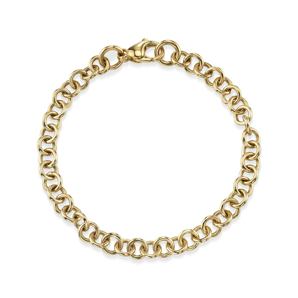 
Single Stone's Mini club bracelet band  featuring Handcrafted 18K yellow gold small link bracelet. Charms sold separately.
Bracelet measures 7.5".
Please inquire for additional customization. 
