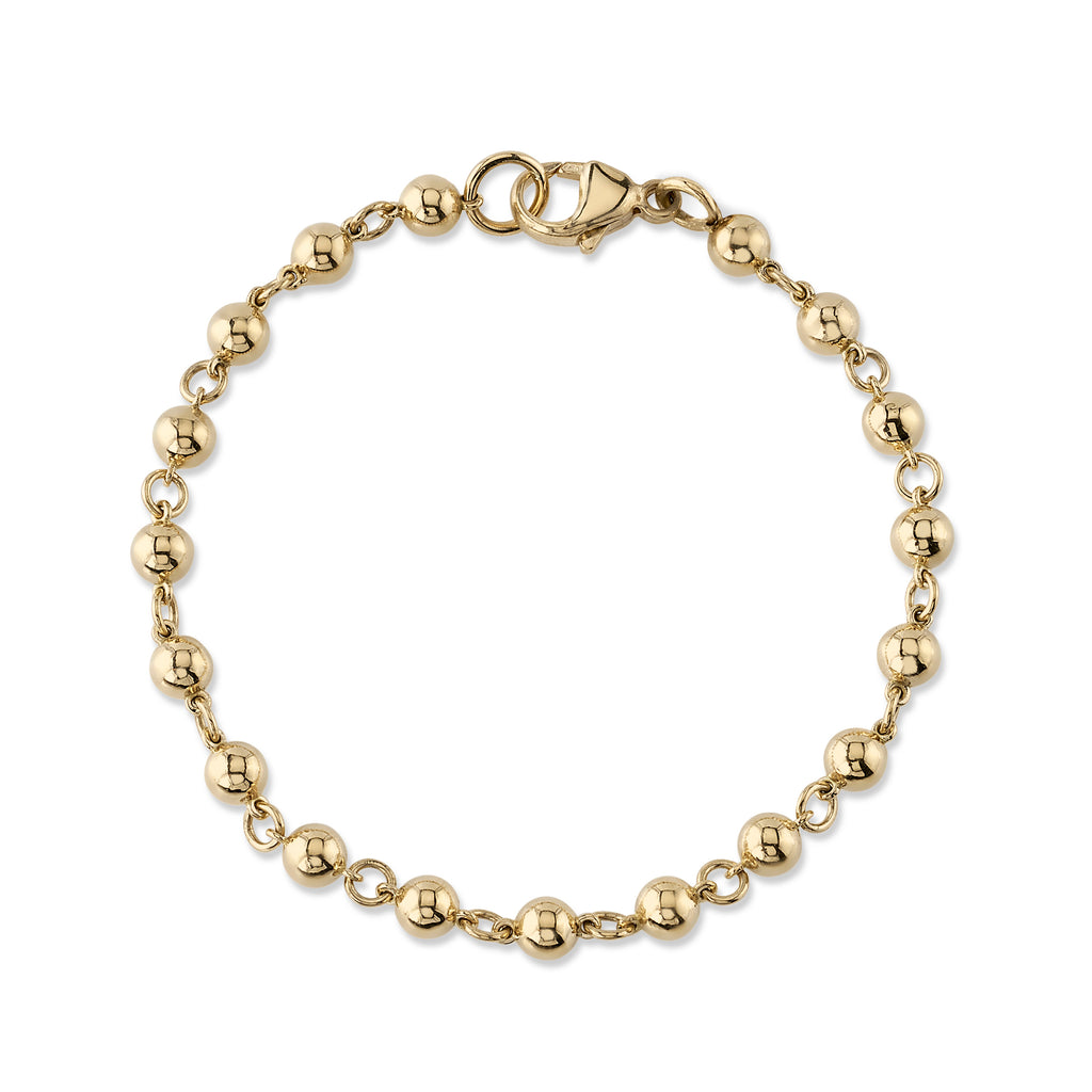 
Single Stone's Mirella bracelet  featuring Handcrafted 18K yellow gold large rosary bead bracelet. Beads measure 5mm in diameter.
Bracelet measures 7.5"
Price does not include charms.
