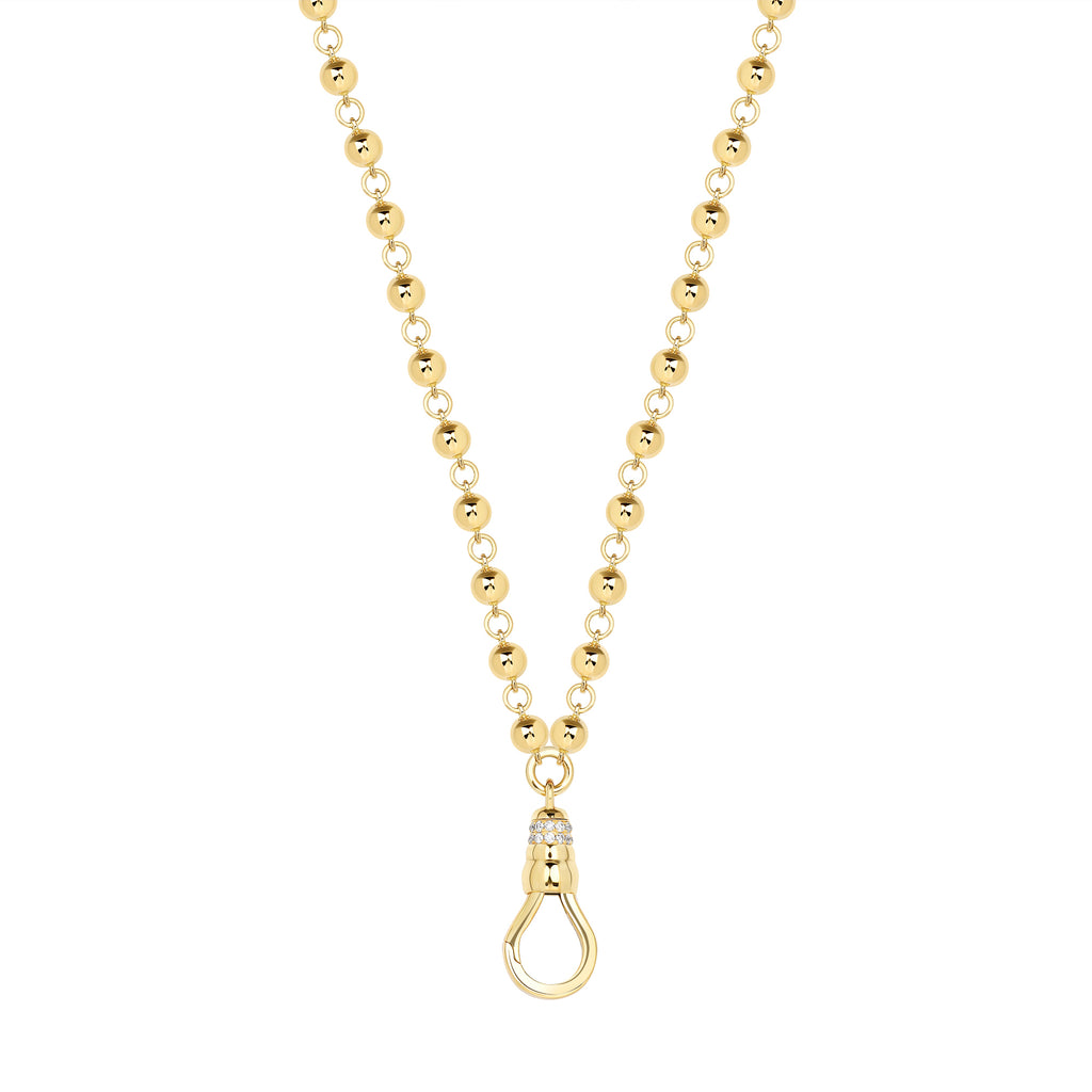 
Single Stone's Mirella fob  featuring Approximately 0.20ctw old European cut diamonds set on a handcrafted 18K yellow gold fob necklace.
Necklace measures 27".
