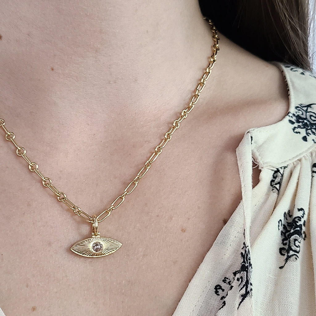 Single Stone's SMALL NAYA pendant  featuring Approximately 0.15ct G-H/VS rose cut diamond bezel set in a handcrafted 18K yellow gold semi-oval shaped pendant.

