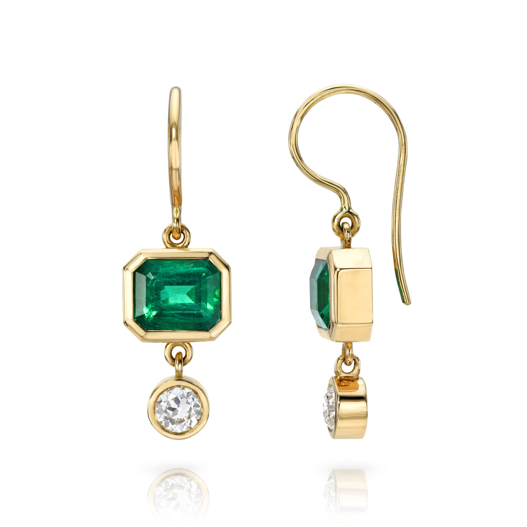 
Single Stone's Paloma double drops earrings  featuring 3.15ctw GIA certified emerald cut green emeralds with 0.60ctw H-I/VS-SI old European cut accent diamonds bezel set in handcrafted double drop earrings.
