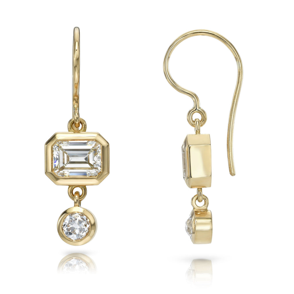 Single Stone's PALOMA DOUBLE DROPS  featuring 2.34ctw M-N/VS1-VS2 GIA certified emerald cut diamonds with 0.50ctw old European cut accent diamonds bezel set in handcrafted 18K yellow gold drop earrings.
