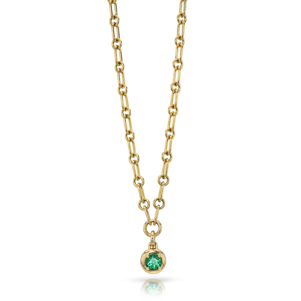 Single Stone's RANDI DROP NECKLACE  featuring 0.53ct round cut green emerald prong set on a handcrafted 18K yellow gold drop pendant necklace.  Necklace measures 17&quot;.
