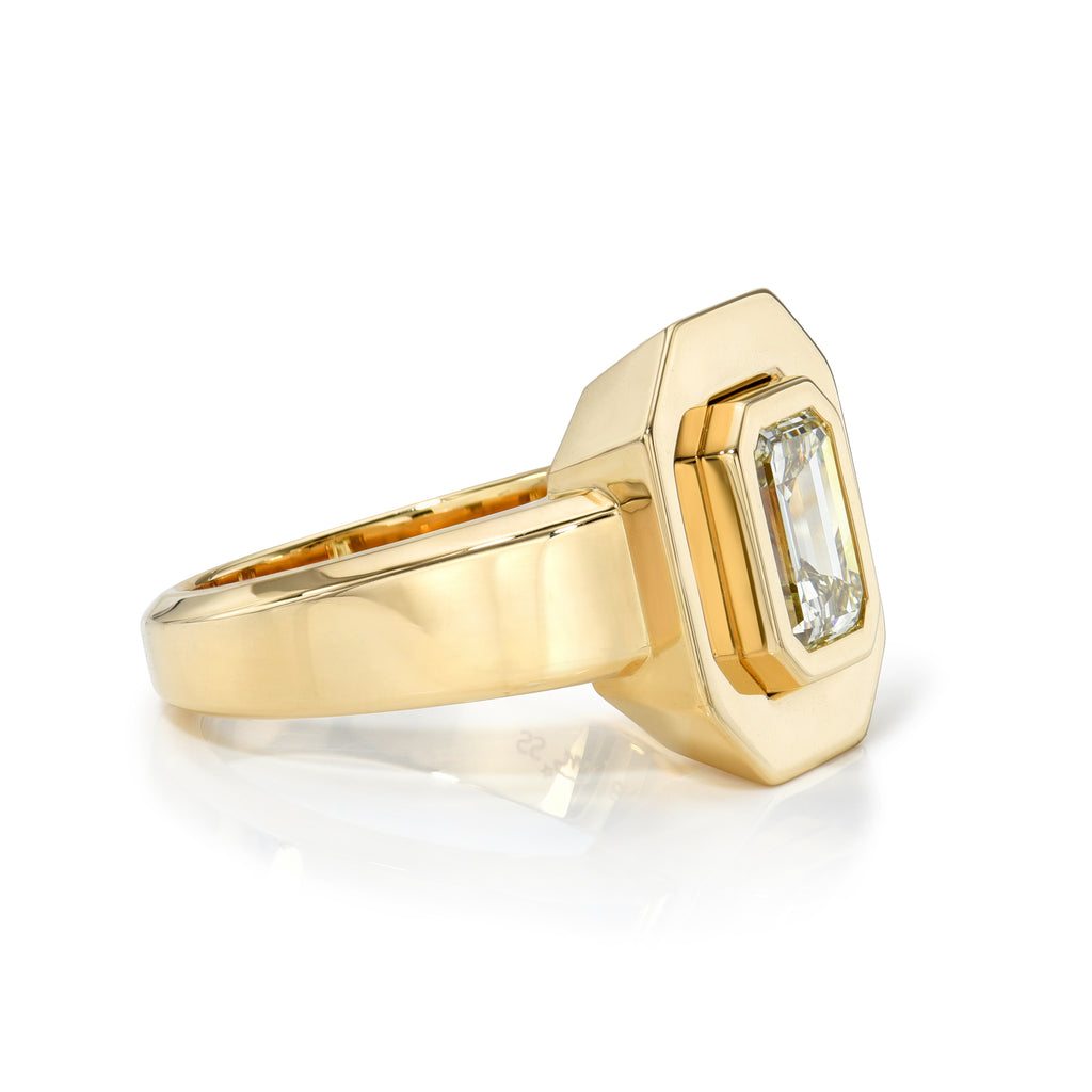 Single Stone's RENA ring  featuring 1.55ct U-V/VS1 GIA certified emerald cut diamond bezel set in a handcrafted 18K yellow gold mounting.
