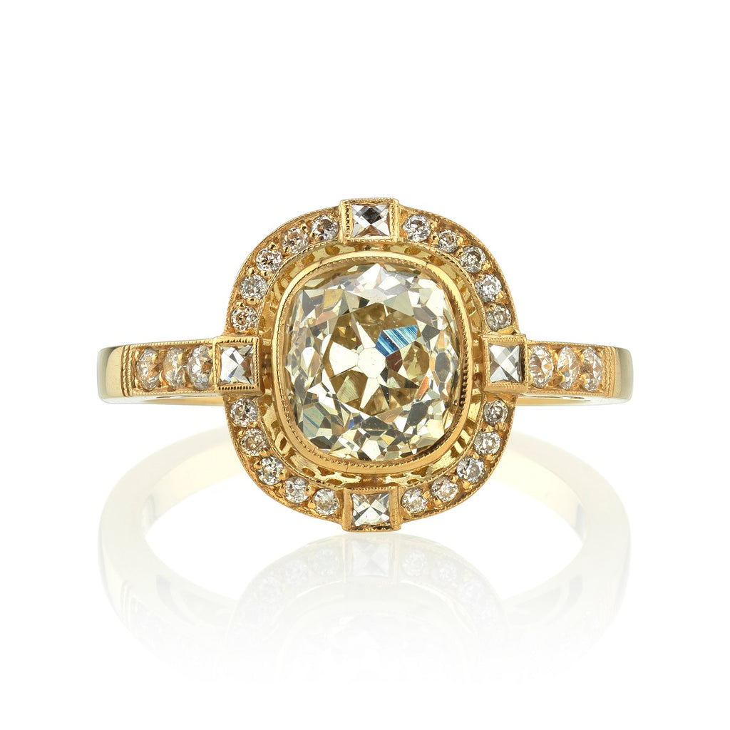 
Single Stone's Shanna ring  featuring 1.73ct K/SI1 EGL certified antique cushion cut diamond with 0.18ctw old European cut accent diamonds and 0.06ctw French cut accent diamonds set in a handcrafted 18K yellow gold mounting. 
 
