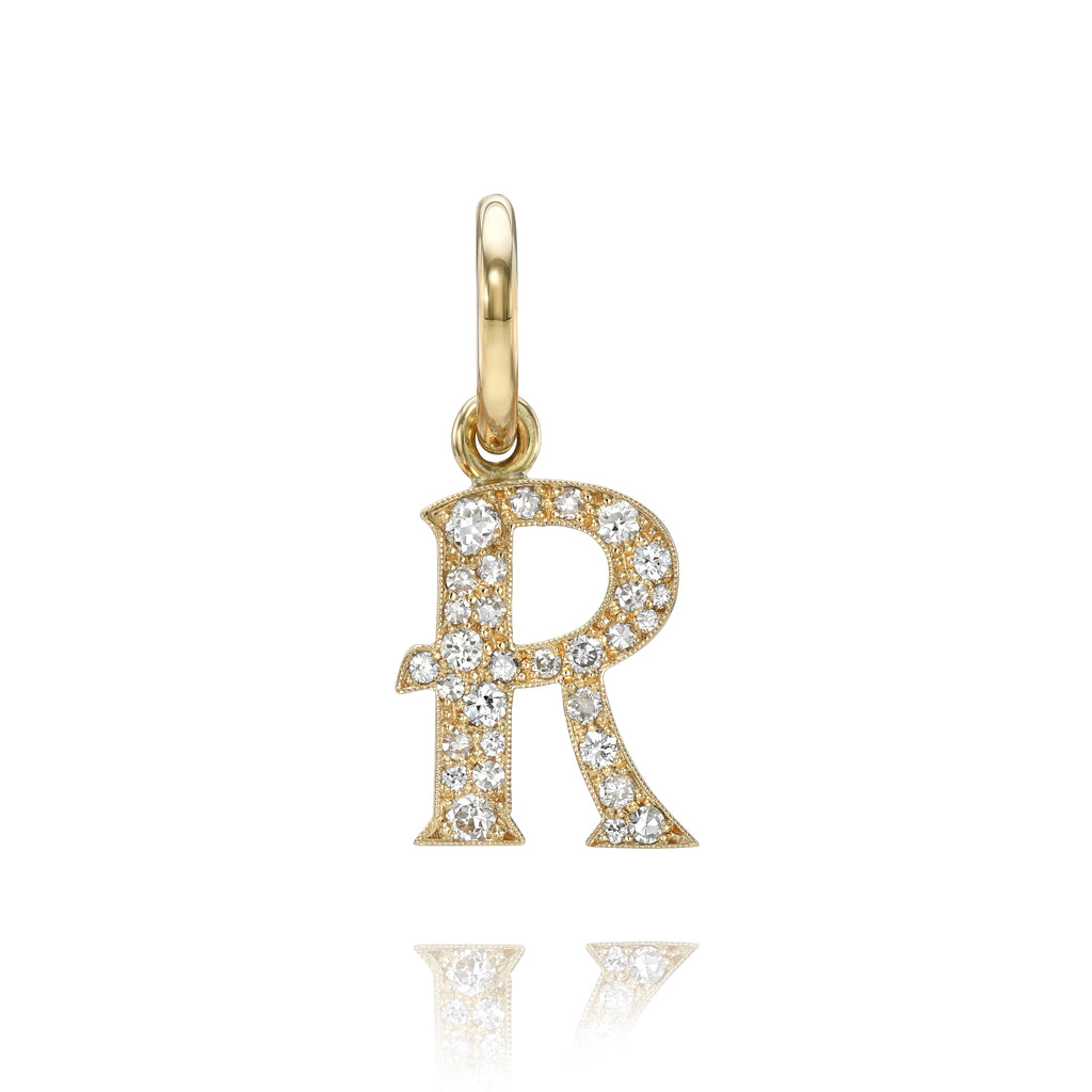 
Single Stone's Small cobblestone letters pendant  featuring Approximately 0.15ctw-0.60ctw varying old and round brilliant cut diamonds set in a handcrafted 18K yellow gold letter pendant. Letters are approximately 1/2" tall. Available in an oxidized or polished finish. Please inquire for additional customization. Price does not include chain, and may vary according to stone weight.
*Cobblestone pattern may vary from piece to piece

