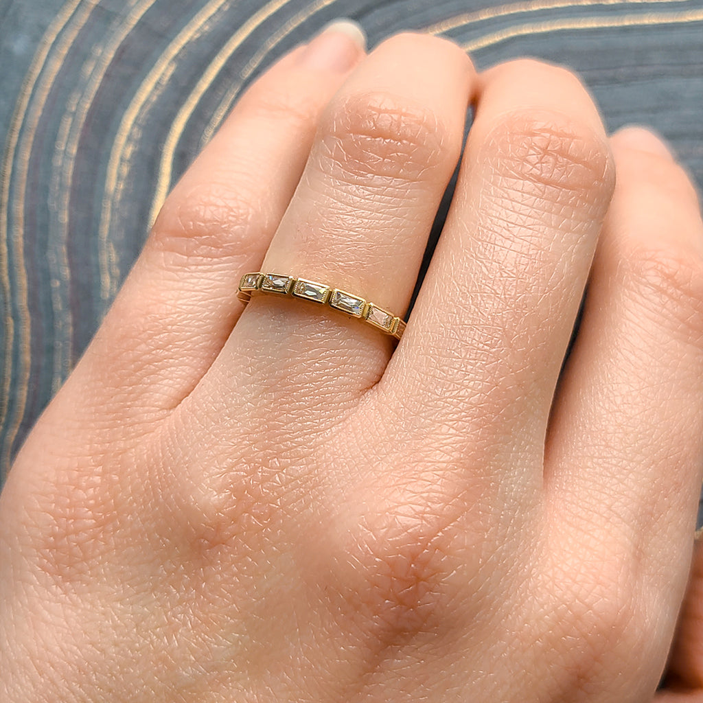 Single Stone's SMALL JULIA band  featuring Approximately 0.75ctw G-H/VS French cut diamonds bezel set in a handcrafted eternity band. Approximate band with 2.1mm. Please inquire for additional customization.
