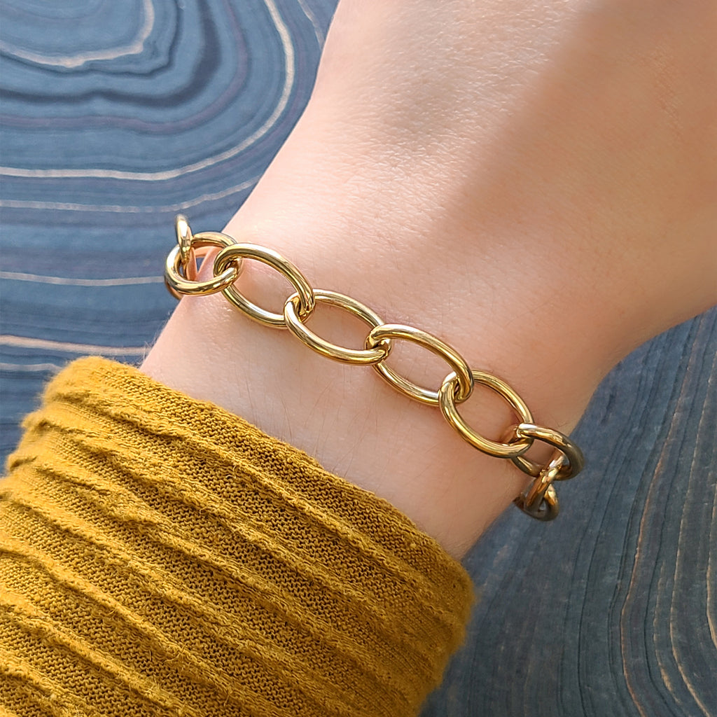 Single Stone's SPORT LUXE BRACELET  featuring Handcrafted 18K yellow gold wide oval link bracelet. Bracelet measures 7.5&quot;.
