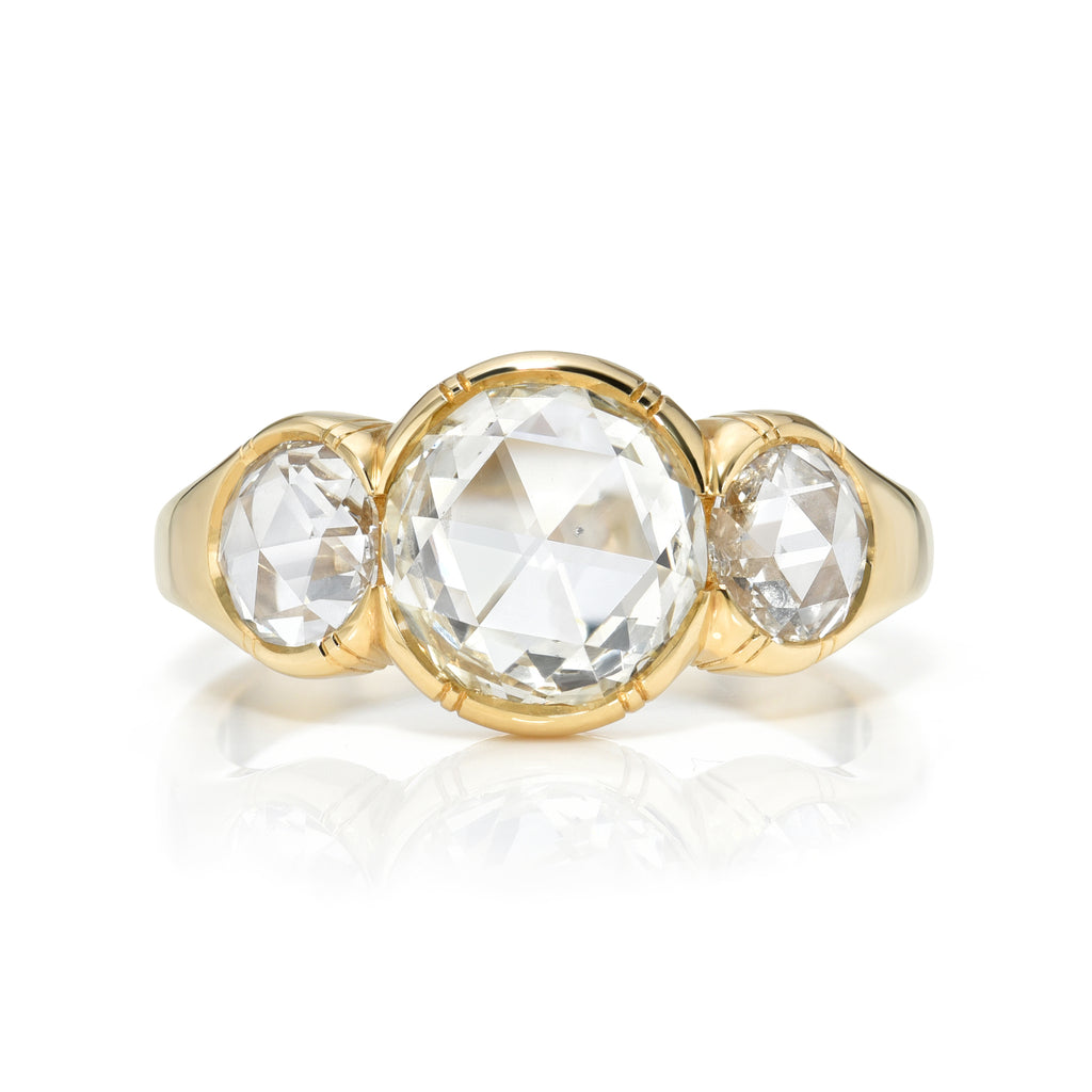 
Single Stone's Three stone brooklyn ring  featuring 1.88ct M/SI1 GIA certified rose cut diamond with 0.80ctw rose cut accent diamonds bezel set in a handcrafted 18K yellow gold mounting.
 
