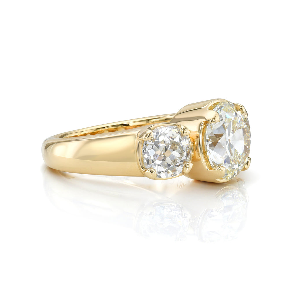 Single Stone's THREE STONE BROOKLYN ring  featuring 2.55ct L/VVS2 GIA certified antique old mine cut diamond with 1.81ctw I-J/I1-SI2 GIA certified antique old mine cut side stones prong set in a handcrafted 18K yellow gold mounting.
