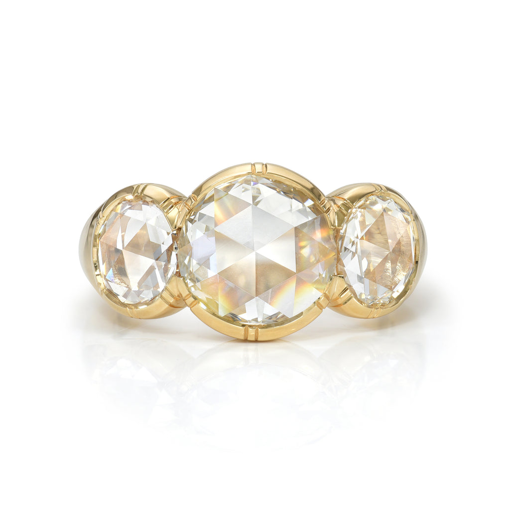 
Single Stone's Three stone brooklyn ring  featuring 1.41ct L/SI1 GIA certified antique round rose cut diamond with 1.41ctw H-L/VS2-SI1 GIA certified rose cut accent diamonds bezel set in a handcrafted 18K yellow gold mounting.
