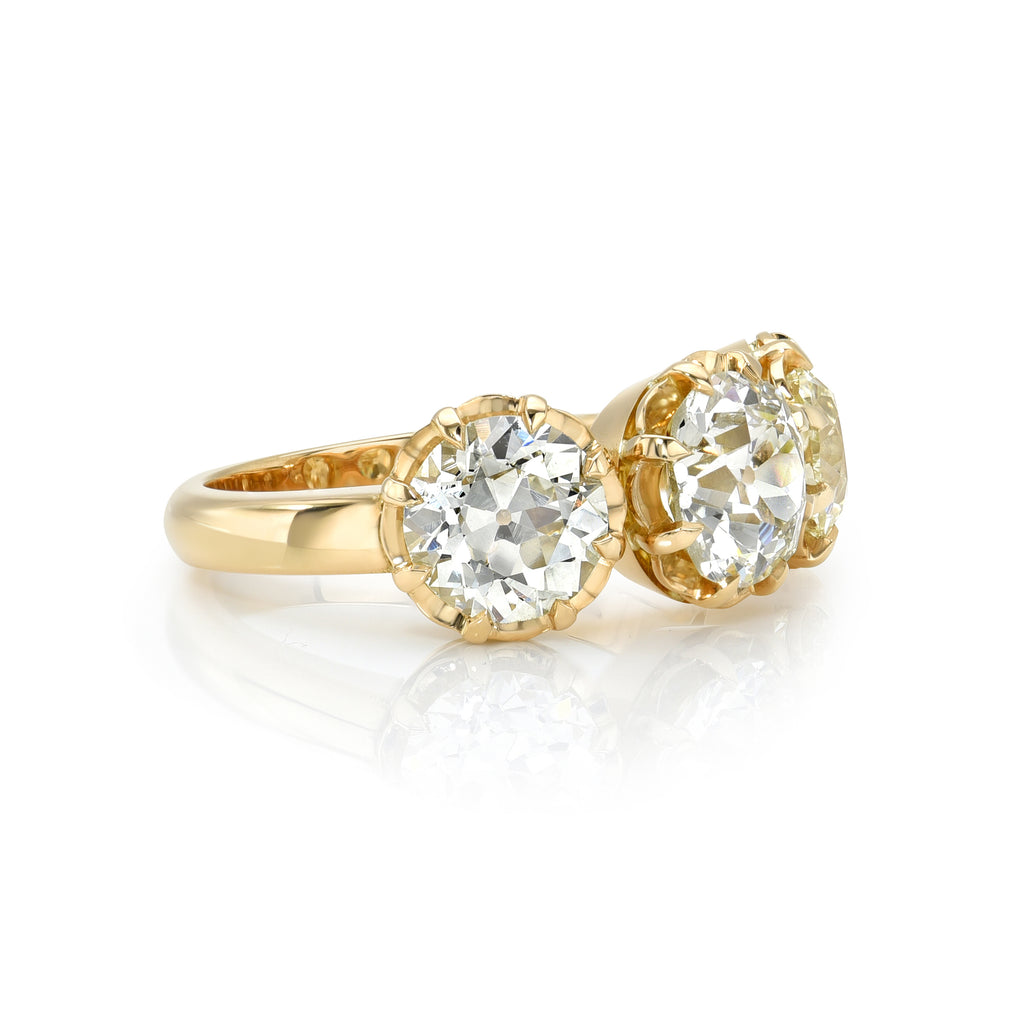 Single Stone's THREE STONE JOLENE ring  featuring 4.10ctw L-M-N/SI1-VS2 GIA certified old European cut diamonds prong set in a handcrafted 18K yellow gold mounting.
