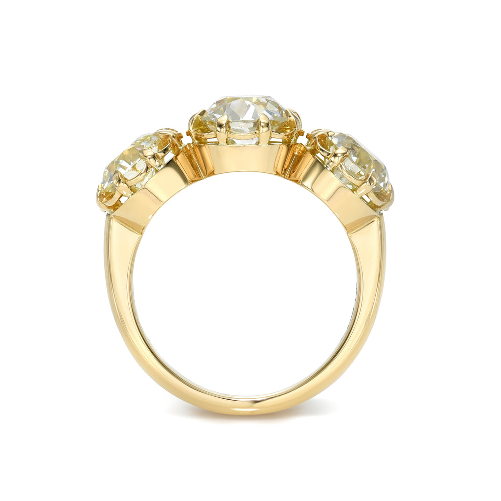Single Stone's THREE STONE JOLENE ring  featuring 4.10ctw L-M-N/SI1-VS2 GIA certified old European cut diamonds prong set in a handcrafted 18K yellow gold mounting.
