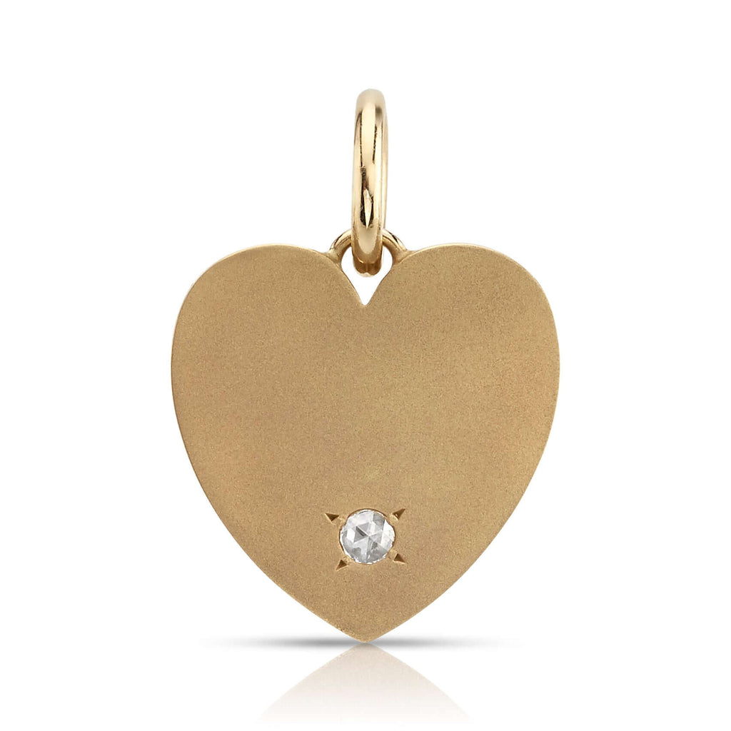 Single Stone's MINNIE WITH DIAMOND pendant  featuring 0.08ctw H/SI rose cut diamond prong set in a handcrafted 18K yellow gold engravable heart shaped pendant. Charm measures 22mm x 21mm. Available in a polished or matte finish.  Price does not include chain.
